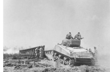A Sherman tank crosses a Bailey bridge. Image courtesy IWM. BaileyBridgeShermanNA14789 edited