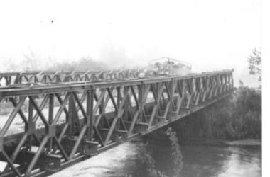 A typical Bailey bridge over the Gari River. Image courtesy IWM. GariBridgeNA14935 edited